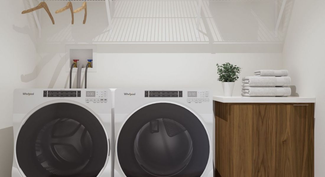 The Oslo A tidy laundry room featuring a modern washer and dryer, organized for efficient laundry tasks.